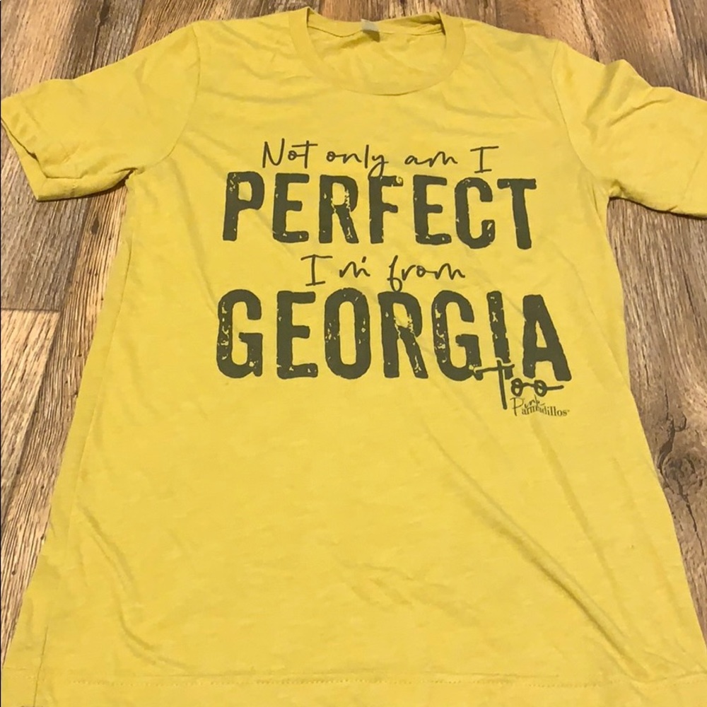 Gold colored small T-shirt